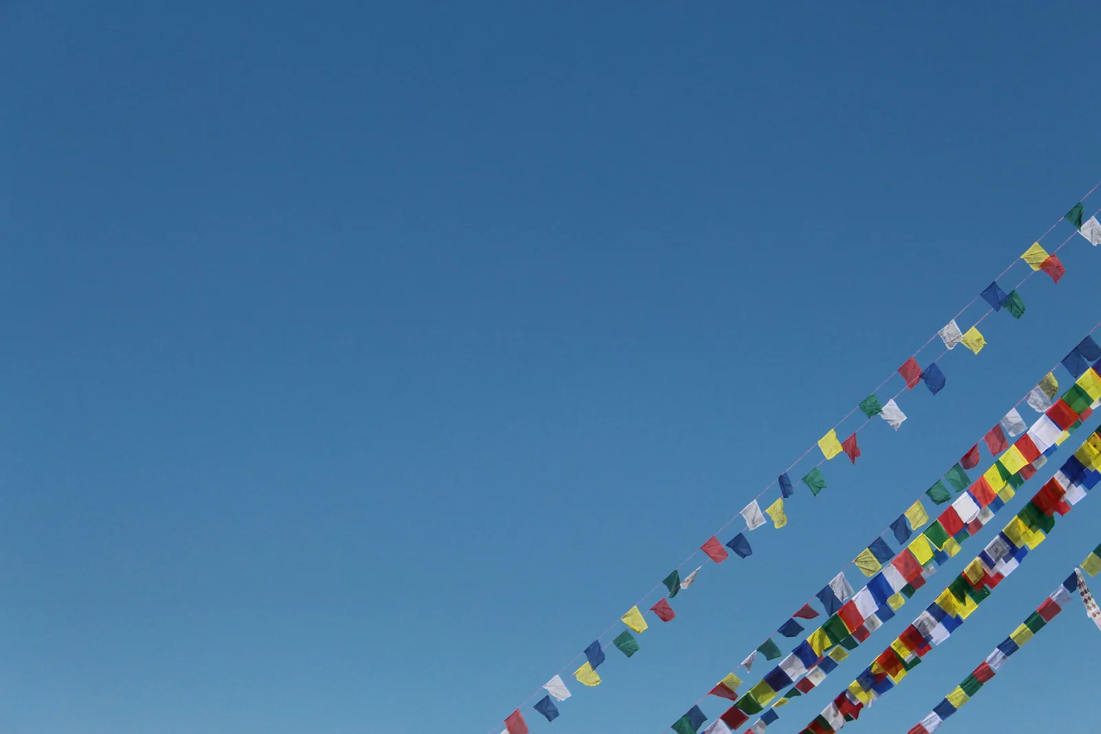 Boudhanath Stupa's whitewashed dome and spire hung with prayer flags in Kathmandu